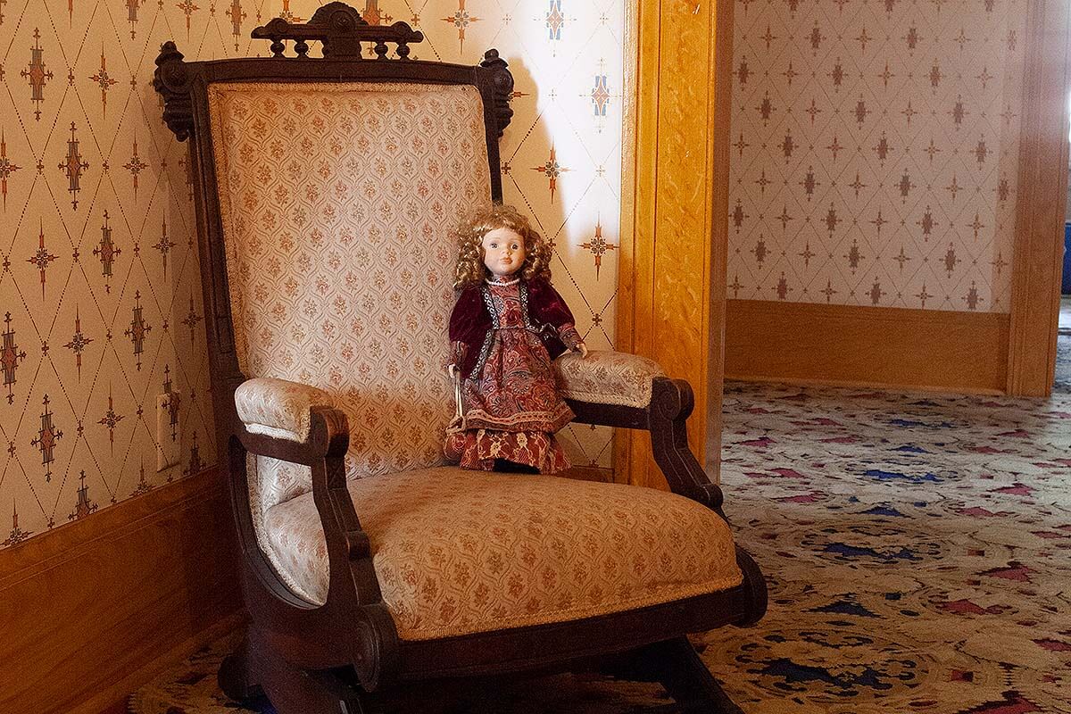 Haunted chair with doll on it inside the Whaley House.