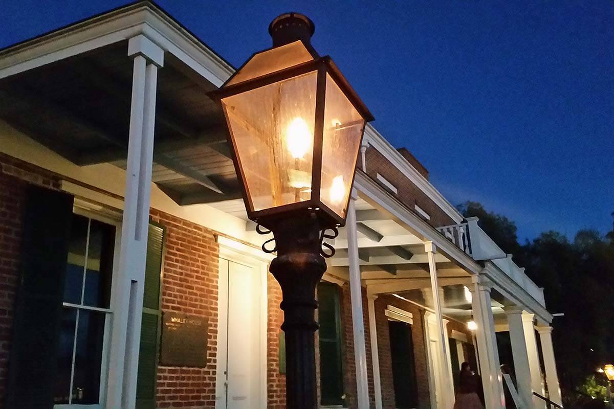 Close-up of a Whaley House gaslamp outside the house.