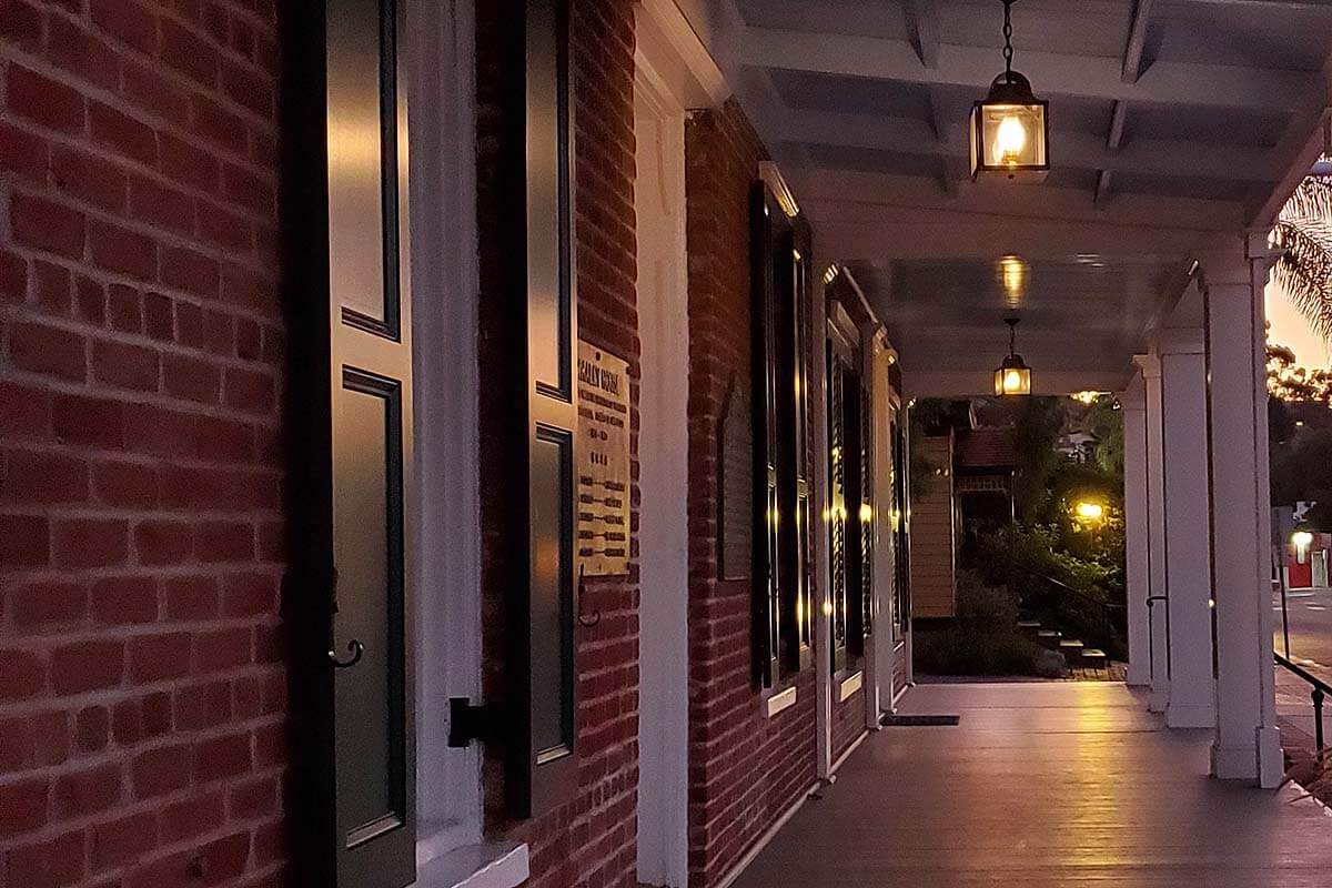 The porch of the Whaley House at night in Old Town San Diego.