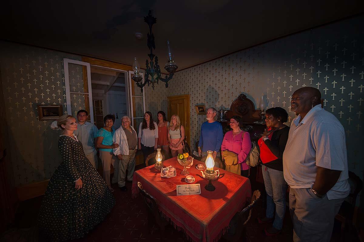 Guests exploring the haunted Whaley House on a tour.