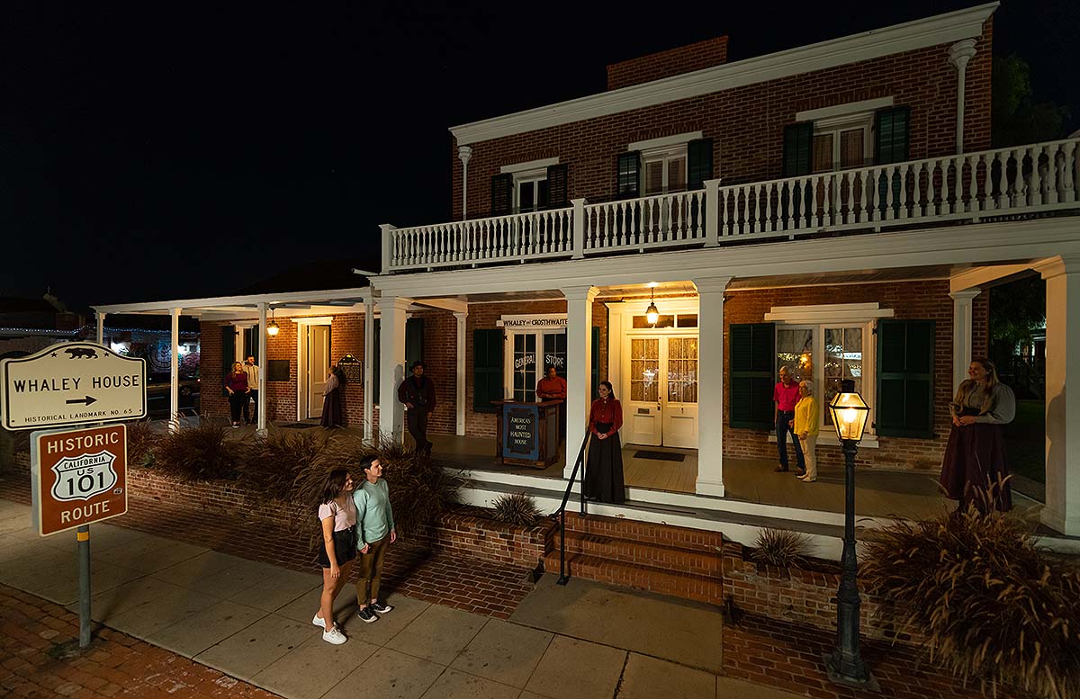 guests arriving at Whaley House at night