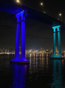 San Diego skyline and part of bridge at night